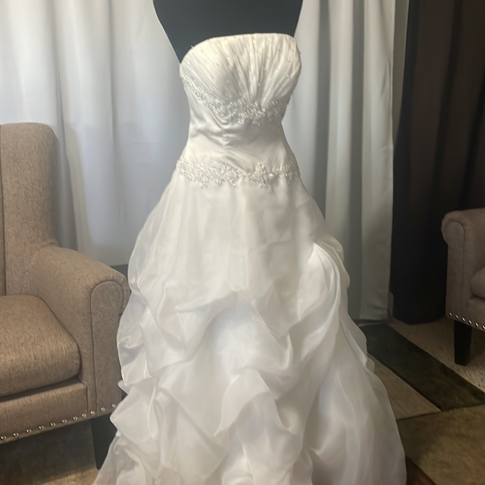 - Ivory ruffled Gown